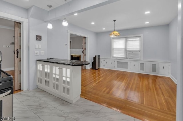 53 Elliot Pl, East Orange City, NJ 07018 - kitchen with electric range, light marble finish floors, recessed lighting, decorative light fixtures, and glass insert cabinets