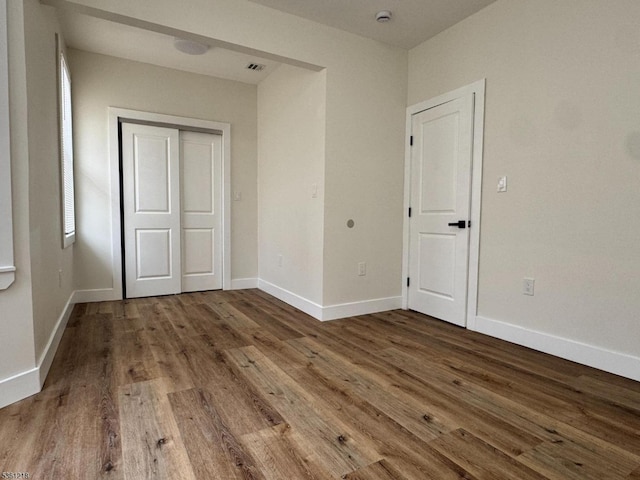 50 Willoughby St, Newark City, NJ 07112 - unfurnished bedroom with wood finished floors and baseboards