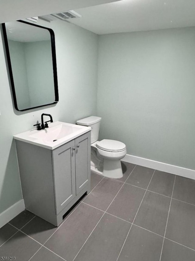 50 Willoughby St, Newark City, NJ 07112 - bathroom with tile patterned flooring, vanity, toilet, and baseboards
