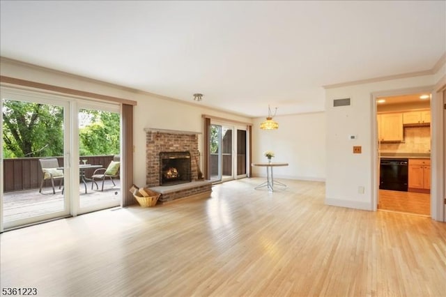 14 Highpoint Unit 14, Cedar Grove Twp, NJ 07009 - unfurnished living room featuring light wood finished floors, healthy amount of natural light, crown molding, a fireplace, and baseboards