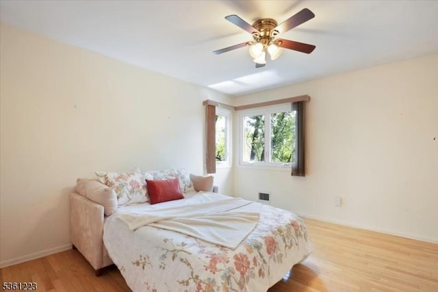 14 Highpoint Unit 14, Cedar Grove Twp, NJ 07009 - bedroom with light wood-style floors, baseboards, and a ceiling fan