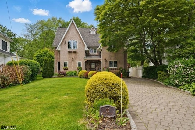 10 Fawn Ter, Jefferson Twp, NJ 07849 - traditional home with stucco siding, a front lawn, and roof with shingles