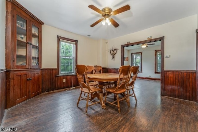 126 Park Ave, Lopatcong Twp, NJ 08865 - dining area featuring a wainscoted wall, plenty of natural light, dark wood finished floors, ceiling fan, and wood walls