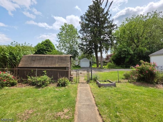 126 Park Ave, Lopatcong Twp, NJ 08865 - view of yard with a gate, a garage, an outdoor structure, and driveway