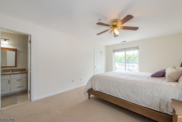 212 Riveredge Dr Unit 212, Chatham Twp, NJ 07928 - bedroom featuring light carpet, baseboards, connected bathroom, a ceiling fan, and a sink