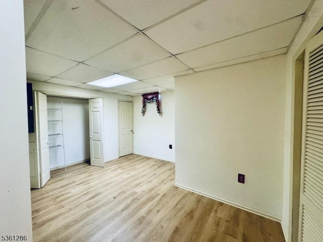123 Pinehurst Dr, Washington Twp, NJ 07882 - unfurnished bedroom featuring wood finished floors, a paneled ceiling, and baseboards