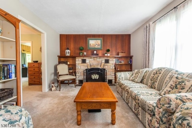 24 W Windy Bush Ln, Sparta Twp, NJ 07871 - living room with plenty of natural light, carpet flooring, a stone fireplace, and wooden walls