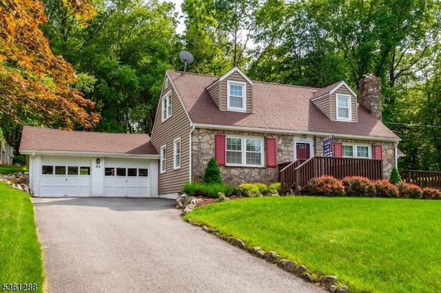 24 W Windy Bush Ln, Sparta Twp, NJ 07871 - cape cod house with stone siding, a chimney, a front yard, a garage, and view of scattered trees