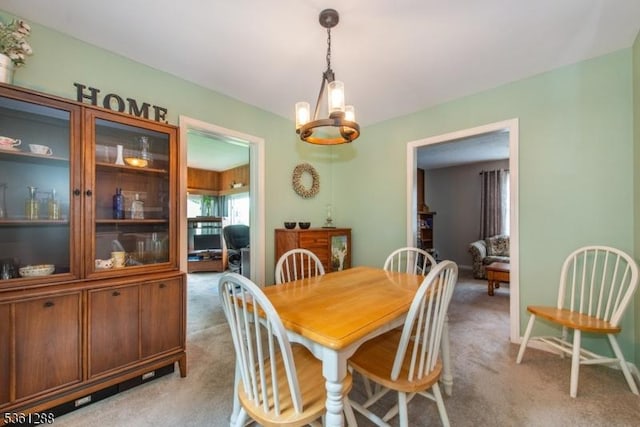 24 W Windy Bush Ln, Sparta Twp, NJ 07871 - dining room featuring light colored carpet and a chandelier