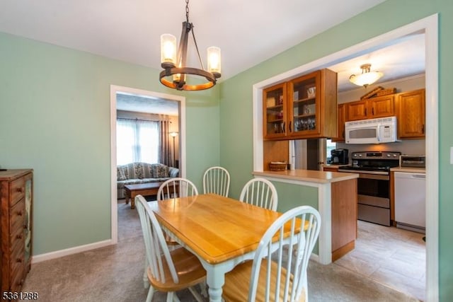 24 W Windy Bush Ln, Sparta Twp, NJ 07871 - dining space featuring a chandelier, baseboards, and light carpet
