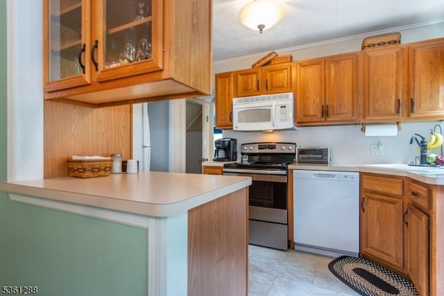 24 W Windy Bush Ln, Sparta Twp, NJ 07871 - kitchen with white appliances, a sink, light countertops, glass insert cabinets, and ornamental molding