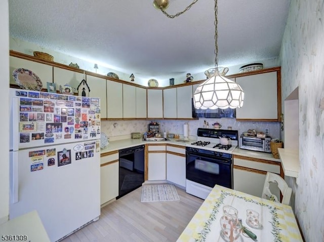 1605 Breckenridge Dr, Branchburg Twp, NJ 08876 - kitchen with white appliances, wallpapered walls, light countertops, light wood finished floors, and decorative backsplash