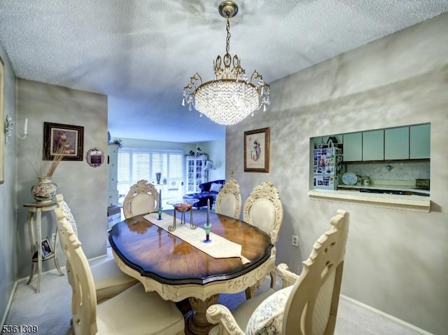 1605 Breckenridge Dr, Branchburg Twp, NJ 08876 - dining space featuring a chandelier, a textured ceiling, and carpet flooring