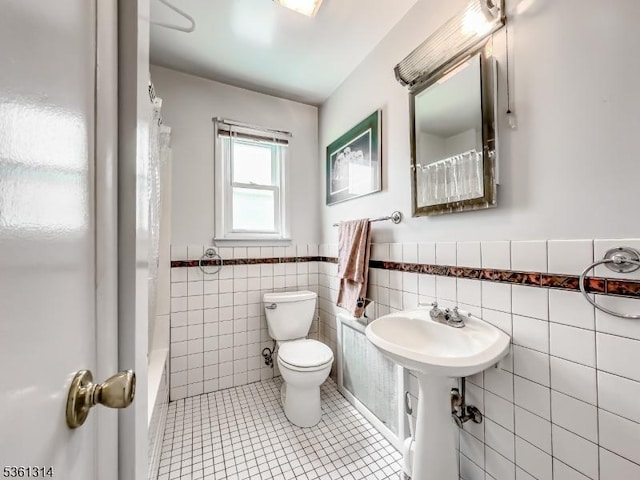 51 Minnehaha Blvd, Parsippany-Troy Hills Twp, NJ 07034 - bathroom with toilet, tile walls, tile patterned floors, and wainscoting