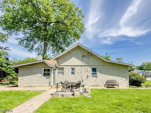 51 Minnehaha Blvd, Parsippany-Troy Hills Twp, NJ 07034 - rear view of property with a yard, a chimney, a patio, and stone siding