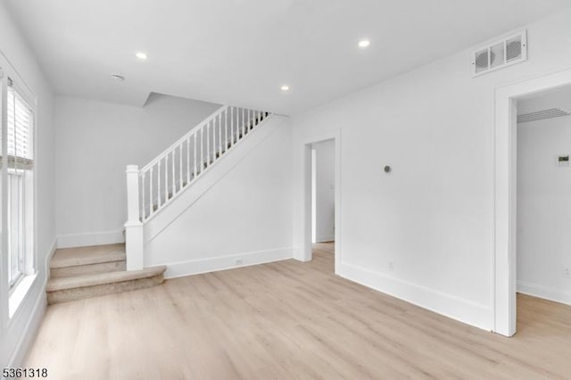 39 Johnson Rd, West Orange Twp, NJ 07052 - unfurnished living room featuring stairs, light wood-style flooring, baseboards, and recessed lighting