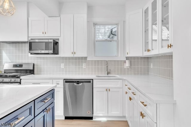 39 Johnson Rd, West Orange Twp, NJ 07052 - kitchen featuring stainless steel appliances, a sink, and white cabinetry