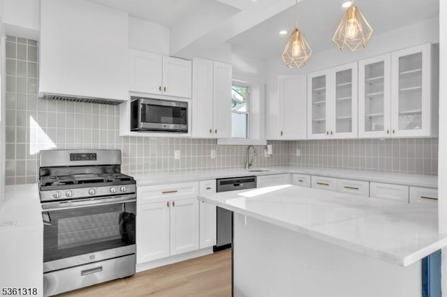 39 Johnson Rd, West Orange Twp, NJ 07052 - kitchen featuring appliances with stainless steel finishes, a sink, and white cabinetry