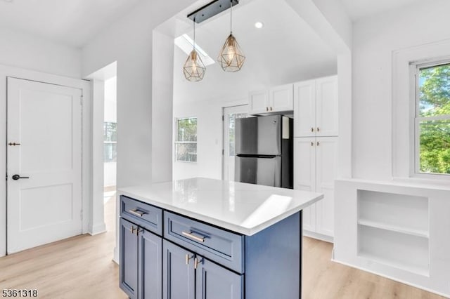 39 Johnson Rd, West Orange Twp, NJ 07052 - kitchen featuring freestanding refrigerator, white cabinetry, light wood-type flooring, pendant lighting, and light countertops