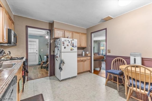 1337 State Route 57, Mansfield Twp, NJ 07865 - kitchen with freestanding refrigerator, stainless steel dishwasher, black microwave, light brown cabinets, and plenty of natural light