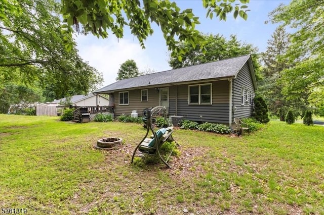 1337 State Route 57, Mansfield Twp, NJ 07865 - back of house featuring an outdoor fire pit, a lawn, and a deck