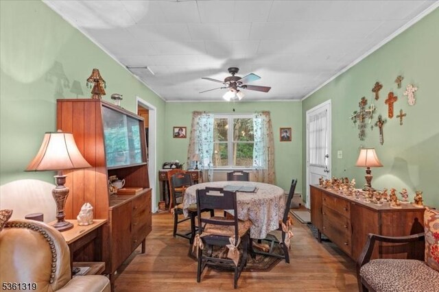 1337 State Route 57, Mansfield Twp, NJ 07865 - dining area with wood finished floors, a ceiling fan, and ornamental molding