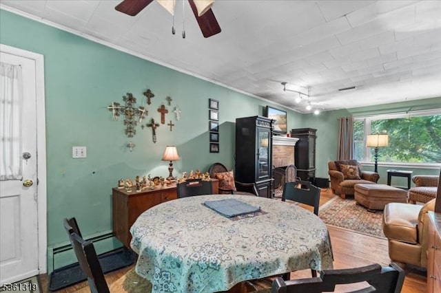 1337 State Route 57, Mansfield Twp, NJ 07865 - dining space featuring wood finished floors, ornamental molding, ceiling fan, and a baseboard heating unit