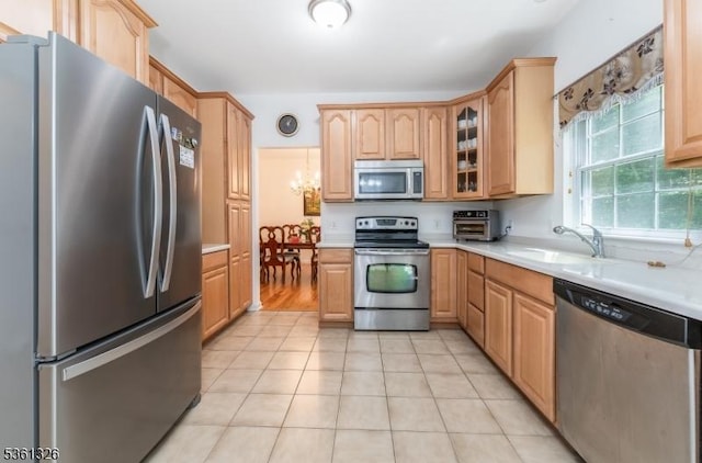 1 Elm St, High Bridge Boro, NJ 08829 - kitchen featuring stainless steel appliances, light countertops, a sink, and glass insert cabinets