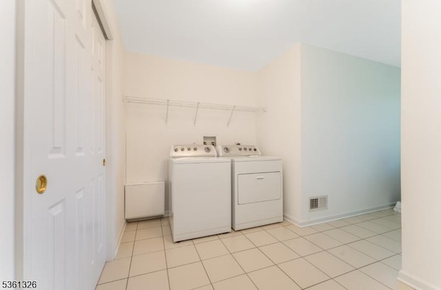 1 Elm St, High Bridge Boro, NJ 08829 - laundry room featuring washer and dryer, baseboards, and light tile patterned floors