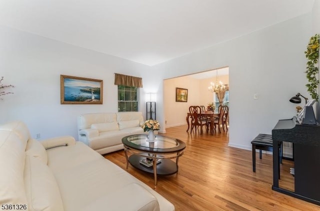 1 Elm St, High Bridge Boro, NJ 08829 - living area with a chandelier, light wood finished floors, and baseboards