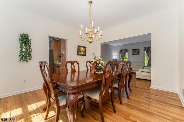 1 Elm St, High Bridge Boro, NJ 08829 - dining room with a chandelier, light wood finished floors, and baseboards