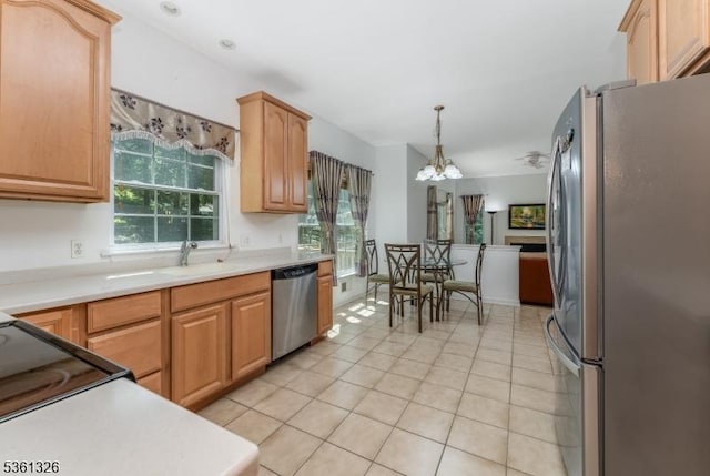 1 Elm St, High Bridge Boro, NJ 08829 - kitchen featuring appliances with stainless steel finishes, light tile patterned flooring, a chandelier, and plenty of natural light