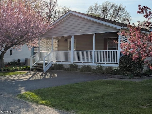 4 Stone Hill Ln, White Twp, NJ 07823 - view of front of property with covered porch, a front lawn, and central AC unit