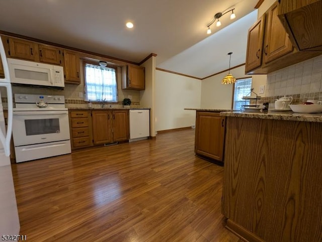 4 Stone Hill Ln, White Twp, NJ 07823 - kitchen featuring white appliances, crown molding, brown cabinets, decorative backsplash, and vaulted ceiling