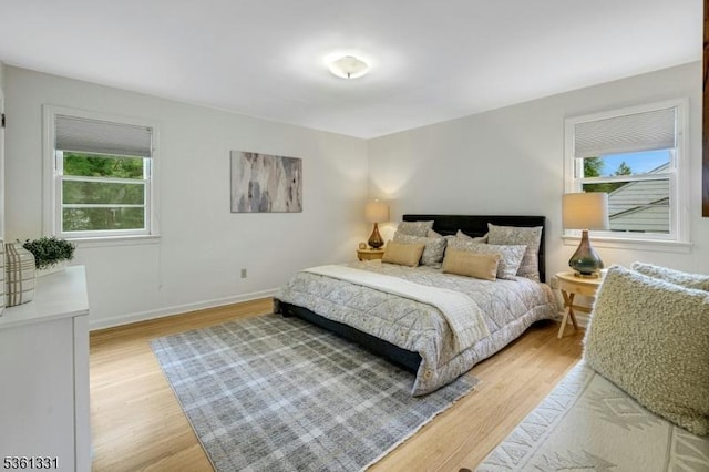 908 Willow Grove Rd, Westfield Town, NJ 07090 - bedroom featuring multiple windows, light wood-type flooring, and baseboards