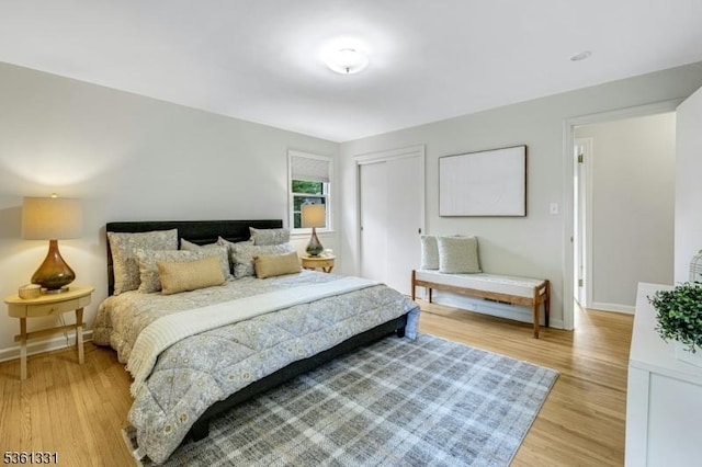 908 Willow Grove Rd, Westfield Town, NJ 07090 - bedroom with light wood-type flooring, a closet, and baseboards