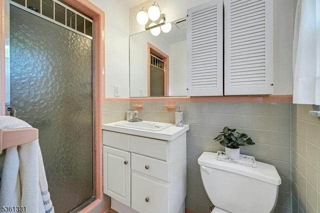 908 Willow Grove Rd, Westfield Town, NJ 07090 - full bathroom with toilet, vanity, a shower stall, tile walls, and tasteful backsplash