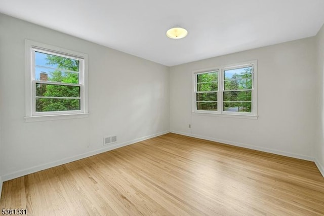 908 Willow Grove Rd, Westfield Town, NJ 07090 - spare room featuring plenty of natural light, light wood-style flooring, and baseboards