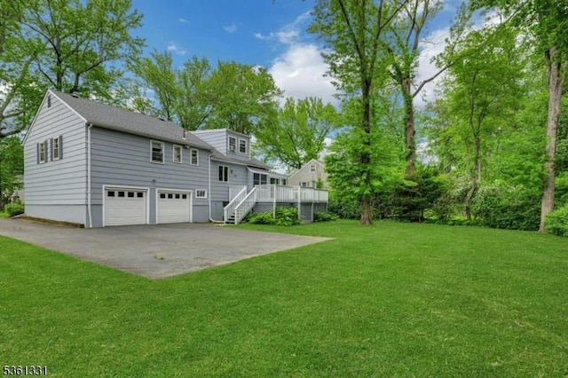 908 Willow Grove Rd, Westfield Town, NJ 07090 - rear view of property with an attached garage, a yard, stairs, a wooden deck, and driveway