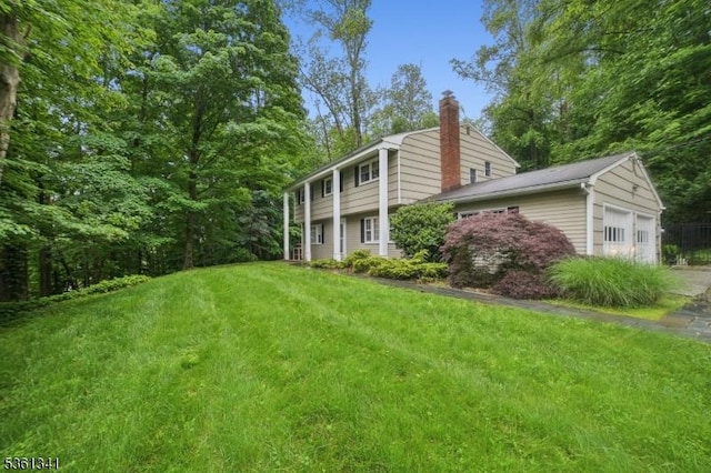 2 Skyline Dr, Morris Twp, NJ 07960 - view of grassy yard featuring an attached garage and driveway