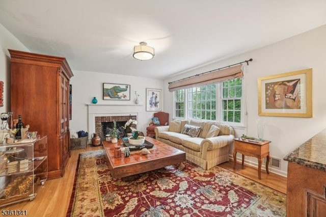 2 Skyline Dr, Morris Twp, NJ 07960 - living area with light wood-style flooring and a fireplace