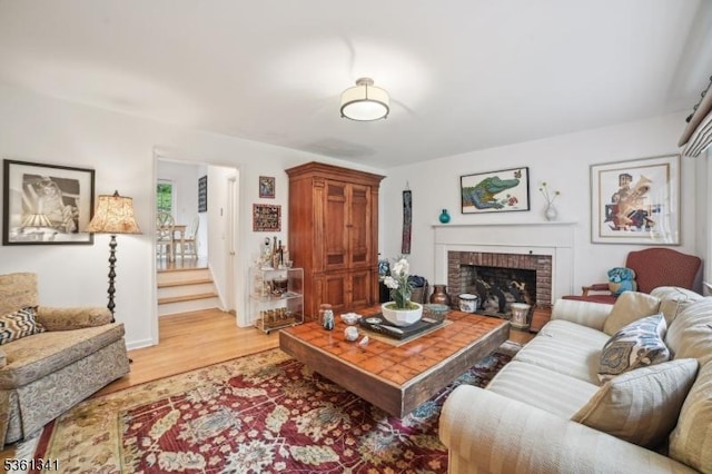 2 Skyline Dr, Morris Twp, NJ 07960 - living room featuring light wood-style flooring, a fireplace, and stairway