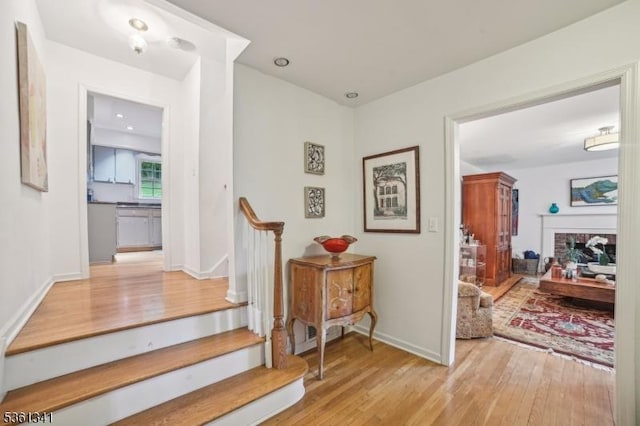 2 Skyline Dr, Morris Twp, NJ 07960 - hall with light wood-style floors, stairway, and baseboards