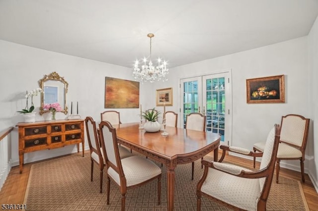 2 Skyline Dr, Morris Twp, NJ 07960 - dining area with light wood-style flooring, a chandelier, french doors, and baseboards