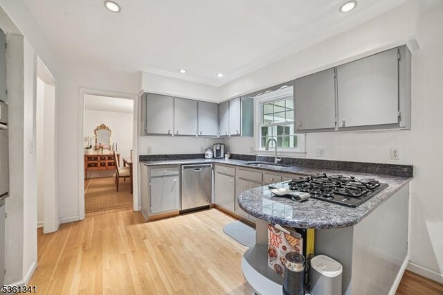 2 Skyline Dr, Morris Twp, NJ 07960 - kitchen with gray cabinets, stainless steel dishwasher, a sink, black gas stovetop, and light wood-style flooring