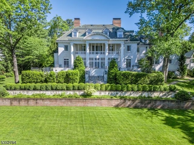 10 Rowan Rd, Summit City, NJ 07901 - rear view of house with a lawn and a chimney