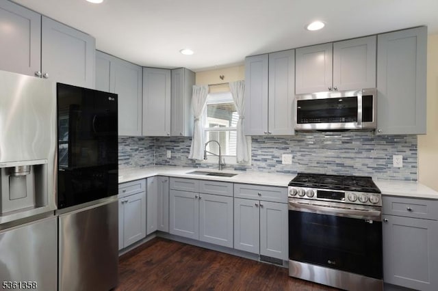 992 Milton Blvd, Rahway City, NJ 07065 - kitchen with appliances with stainless steel finishes, gray cabinetry, light countertops, decorative backsplash, and recessed lighting