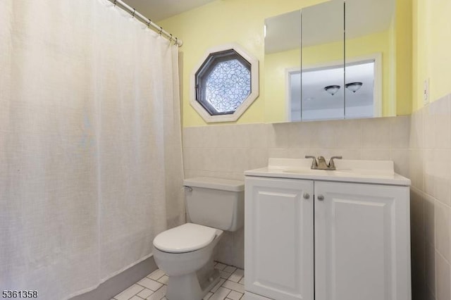 992 Milton Blvd, Rahway City, NJ 07065 - bathroom with tile walls, vanity, and tile patterned floors