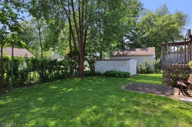 992 Milton Blvd, Rahway City, NJ 07065 - view of green lawn featuring a deck and a storage shed