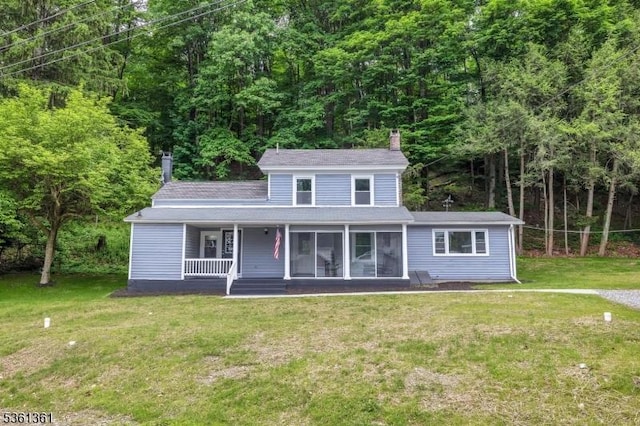 18 Ann St, Knowlton Twp, NJ 07832 - view of front of house featuring a chimney, a front yard, a wooded view, and a porch